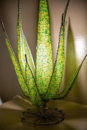 two ears of corn in a vase on a table at Blyde River Wilderness Lodge in Hoedspruit
