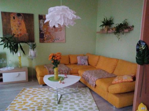 a living room with a couch and a table at Ferienwohnung Halle Saale in Halle an der Saale