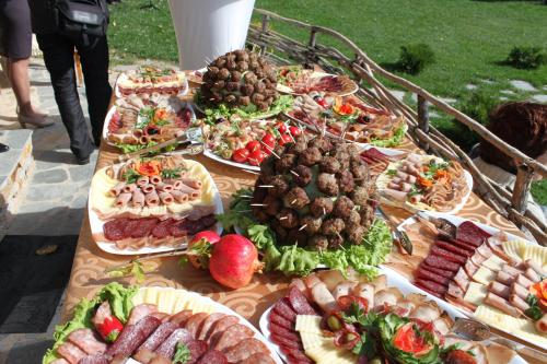 a table with many different types of food on it at Eco Village Under the Cliffs in Ilindentsi