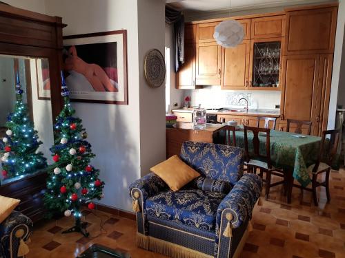 a living room with a christmas tree in a kitchen at Residence Luisa in Avezzano