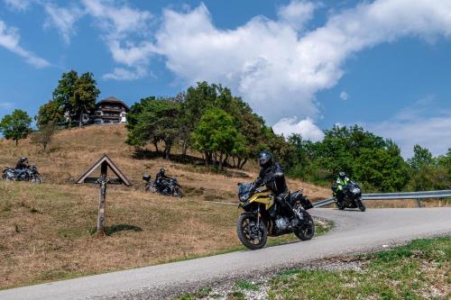 a group of people riding motorcycles on a road at Ferienwohnungen Panorama Harrys Bike Tours in Villach