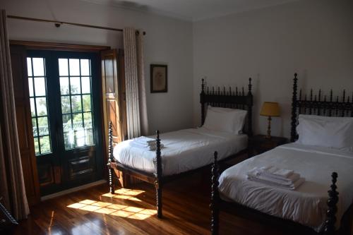 Quinta do Bacelo, Casa completa, 4 quartos e piscinaにあるベッド
