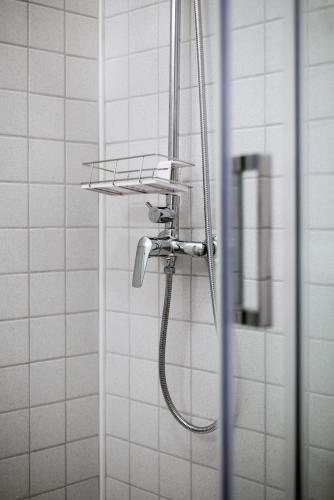 a shower with a shower head in a bathroom at Accomodation Gina in Zadar