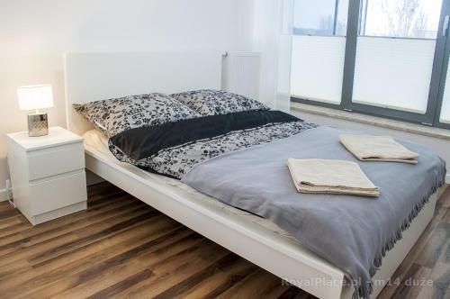 Letto o letti in una camera di Apartament Royal Place Jurowiecka 19