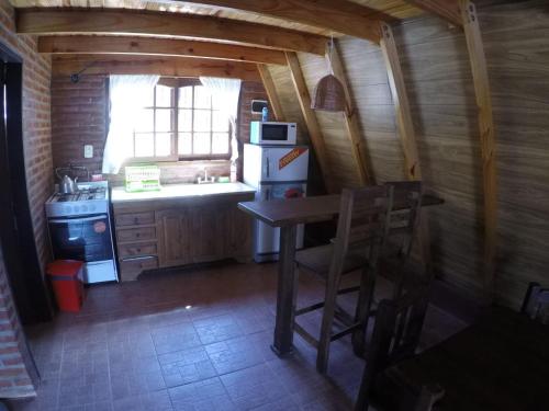 Kuchyň nebo kuchyňský kout v ubytování Cabaña Abuelo Ernesto 2