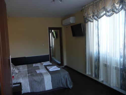 Postel nebo postele na pokoji v ubytování Guest House Camellia