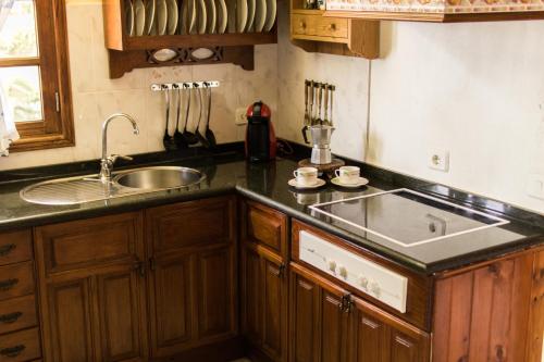 a kitchen with a sink and a counter top at Casa Nora in Güime