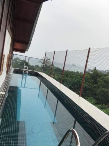 a swimming pool on top of a building at Domus Guesthouse in Santana
