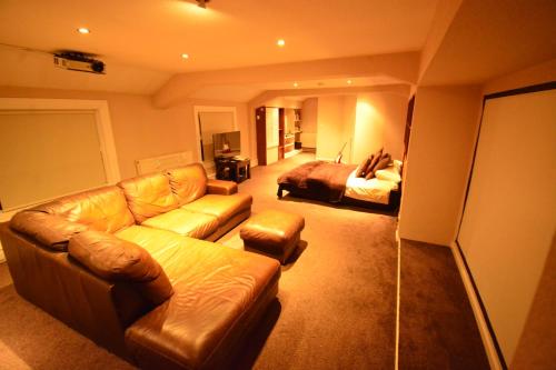 a living room with a couch and a bed at Aparthotel Glovers Court in Preston
