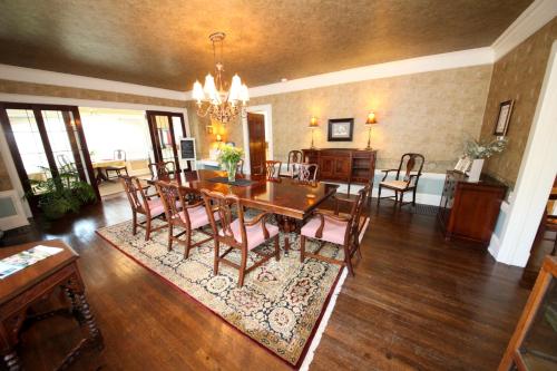 a dining room with a table and chairs at Leonard at Logan House in Grand Rapids