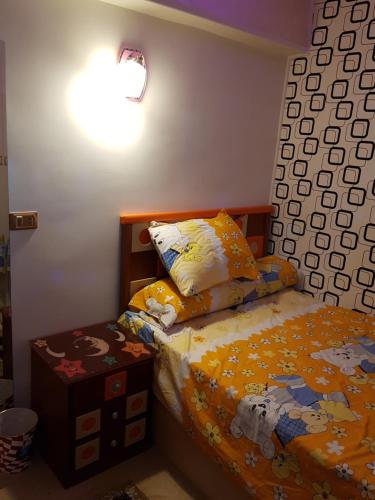 Postel nebo postele na pokoji v ubytování Al Mansoura Apartment