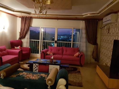 Posezení v ubytování Al Mansoura Apartment