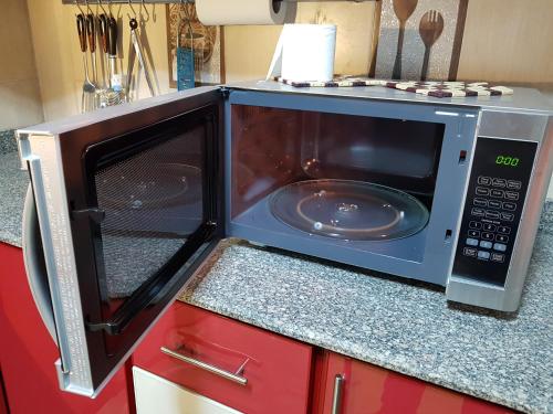 Kuchyň nebo kuchyňský kout v ubytování Al Mansoura Apartment