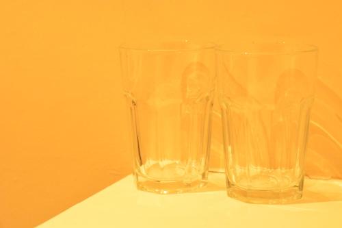 two glasses sitting next to each other on a table at Aparthotel Glovers Court in Preston