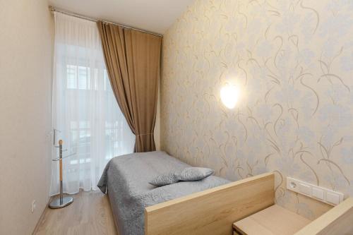 Кровать или кровати в номере SaintHouse on Pochtamtskaya