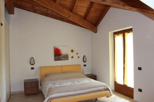 Ένα ή περισσότερα κρεβάτια σε δωμάτιο στο Villetta Nembra
