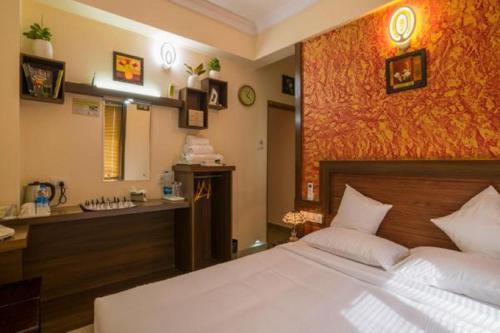 Кровать или кровати в номере Blue Bell Cochin Airport Hotel