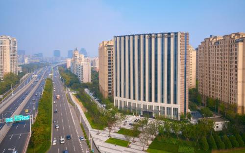 a view of a highway in a city with tall buildings at LJZ Supreme Tower Hotel in Shanghai