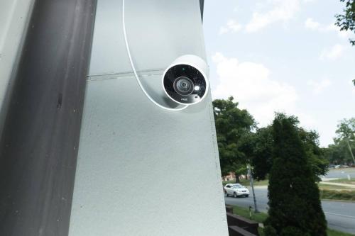a security camera on the side of a building at Trifecta 10 Min Walk to 7th St Market Superhost in Charlotte