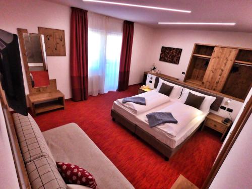 Postel nebo postele na pokoji v ubytování Hotel Cristallo