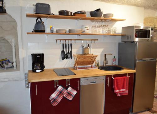 Kjøkken eller kjøkkenkrok på Les Troglos de l'Echeneau