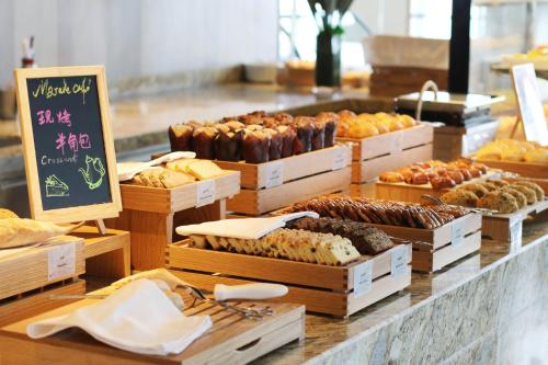a bakery with many different types of pastries on display at Hyatt Regency Shanghai Jiading in Jiading