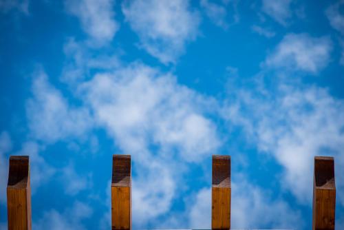 a row of wooden posts against a cloudy sky at Palazzo San Giovanni Amalfi Coast in Scala