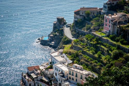 an aerial view of a town next to the ocean at Palazzo San Giovanni Amalfi Coast in Scala