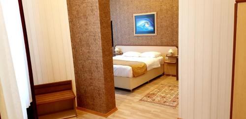 Ein Bett oder Betten in einem Zimmer der Unterkunft EmexOtel Kocaeli
