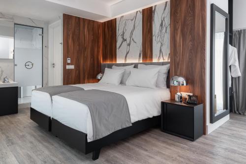 Postel nebo postele na pokoji v ubytování Elia Ermou Athens Hotel
