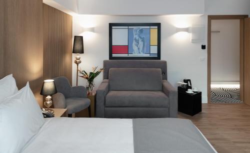 Postel nebo postele na pokoji v ubytování Elia Ermou Athens Hotel