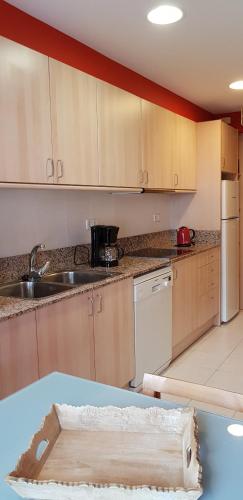 a kitchen with a sink and a counter at Soldeu Paradis Soldeu in Soldeu