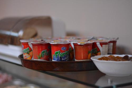 a tray of canned food on a table with a bowl of food at Penzion u Bednářů in Pavlov