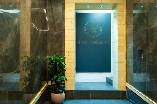 a hallway with a sign on a wall in a building at SohoSuites Villavieja in Alicante