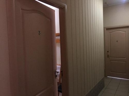 an open door in a room with a hallway at Sun in Khmelʼnytsʼkyy