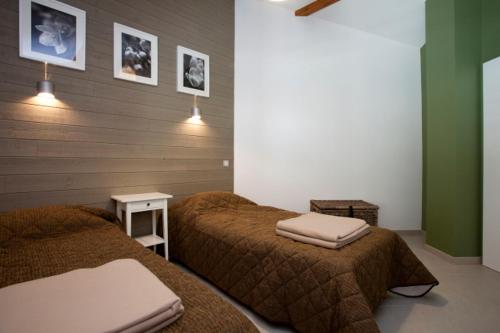 Giường trong phòng chung tại Les Granges de Leo