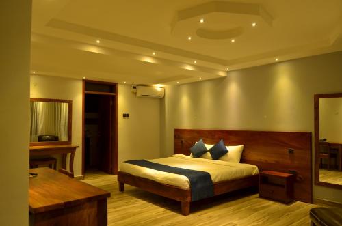A bed or beds in a room at Nile Village Hotel & Spa