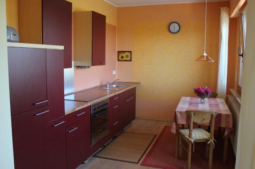 a small kitchen with a table and a sink at Ferienwohnung zur Burg Eltz in Wierschem