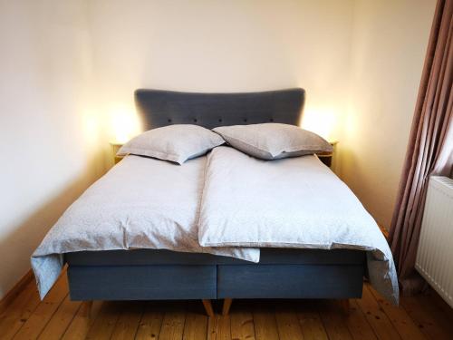 Een bed of bedden in een kamer bij Landhaus Eilenberg Holzhau