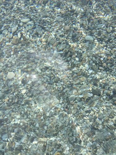 a bunch of rocks in the water at La Casa del Miele di Borgo Carbone in Locri