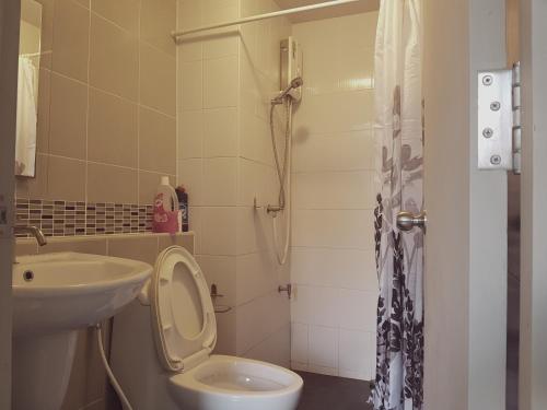 a bathroom with a sink and a toilet and a shower at D Condo Kathu-Patong Phuket by Jacky in Kathu