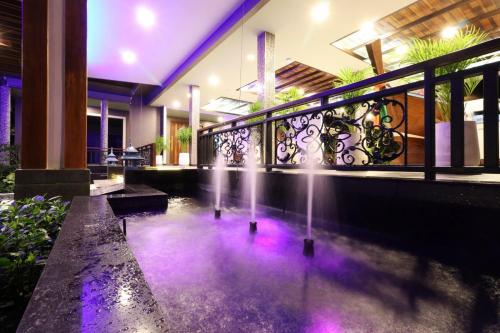 a water fountain in the middle of a building at The Scene Cliff View Villas in Ao Nang Beach