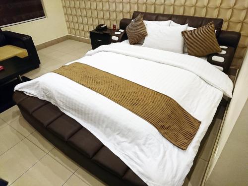 Hotel Akbar Internationalにあるベッド