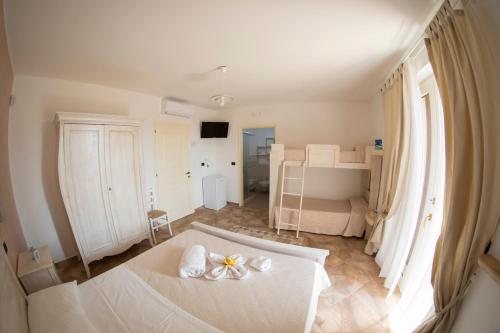 a bedroom with a white bed with flowers on it at Blue And Blue City in Ugento