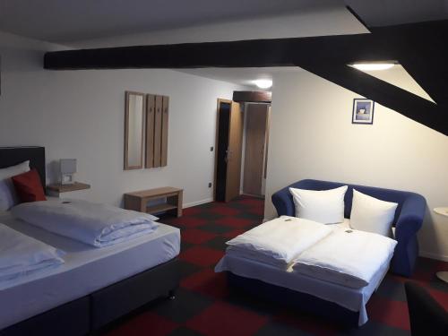 Postel nebo postele na pokoji v ubytování Hotel Luca