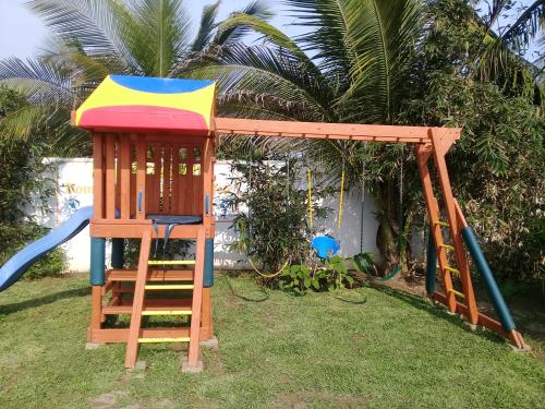 a playground with a tower and a swing at Hotel La Estrella Polar in Costa Esmeralda