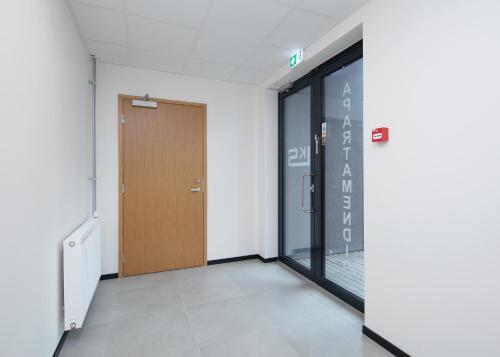 an empty hallway with a door in a building at LKS Apartment 4 in Tallinn