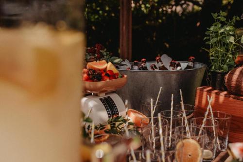 a table with a bowl of food and a bucket of fruit at Hotel Rio Bidasoa in Hondarribia