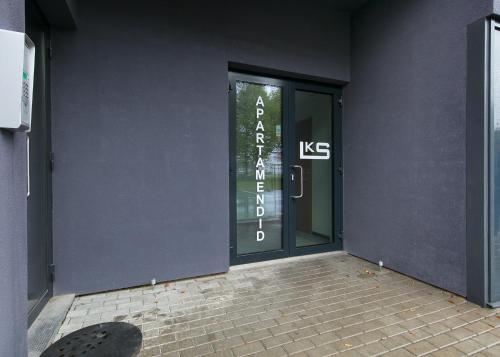 an entrance to a building with a glass door at LKS Apartment 5 in Tallinn