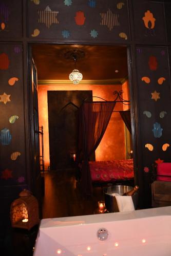 a room with a bedroom with a bed and a mirror at Vip room 209 in Trooz